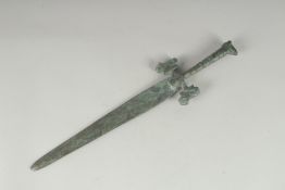 AN ARCHAIC STYLE DAGGER, the handle with zoomorphic terminals, 43cm long.