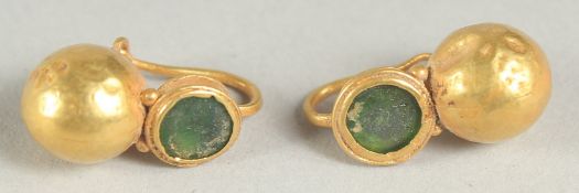 A PAIR OF BYZANTINE GOLD EARRINGS, inset with natural green garnets.