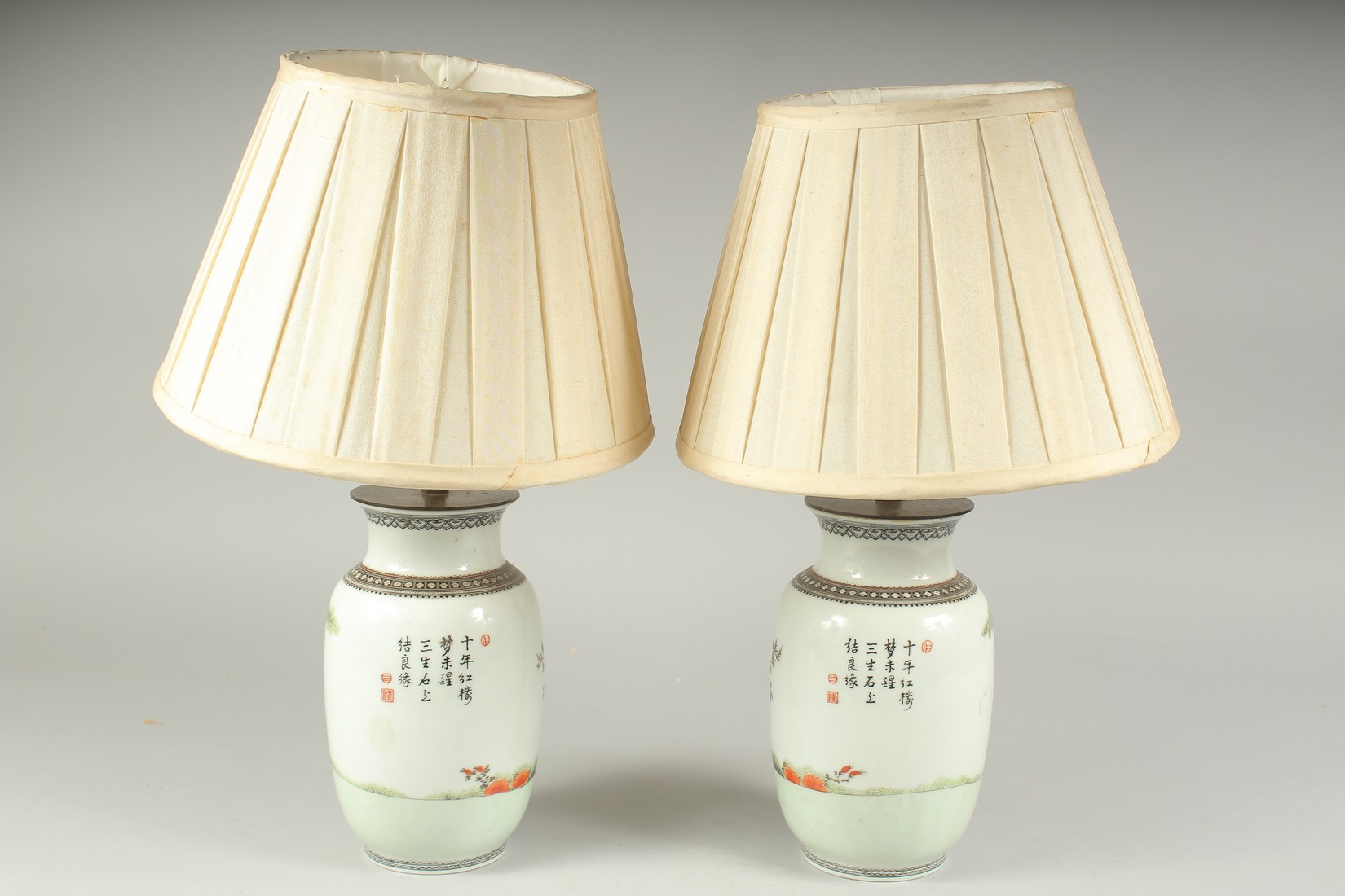 A PAIR OF CHINESE FAMILLE ROSE PORCELAIN VASE LAMPS, each painted with figures in a garden and - Image 4 of 7