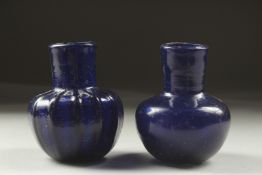 TWO INTACT 8TH OR 9TH CENTURY PERSIAN GLASS BOTTLES.