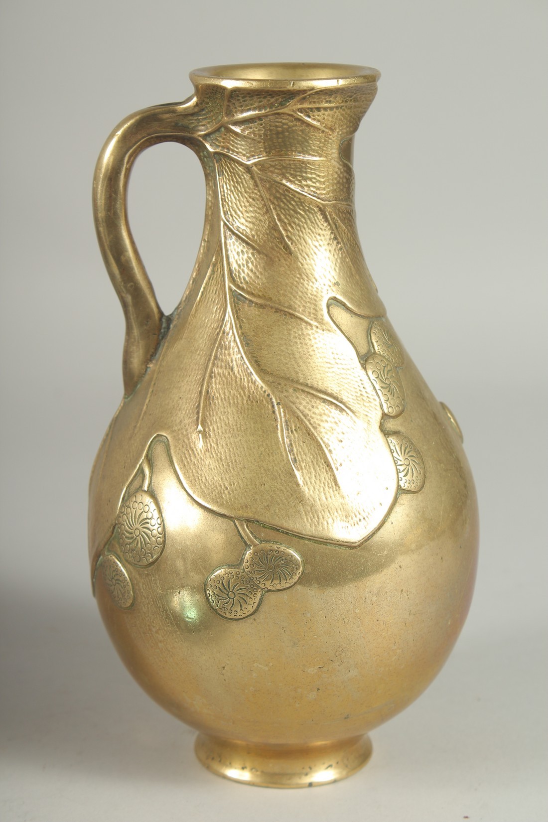 A JAPANESE BRASS JUG, with relief foliate decoration, 23cm high. - Image 3 of 6