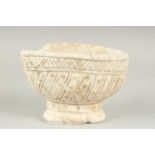 A RARE 11TH - 12TH CENTURY POSSIBLY ANDLUSIAN ALMOHAD SPANISH CARVED WHITE MARBLE FOOTED BOWL, 19.