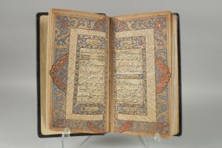 A 19TH CENTURY NORTH INDIAN KASHMIR LEATHER BOUND ILLUMINATED QURAN, the manuscript written in naskh