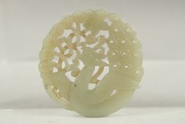 A FINE 19TH-EARLY 20TH CENTURY CHINESE CARVED JADE ROUNDEL, 5.5cm wide.