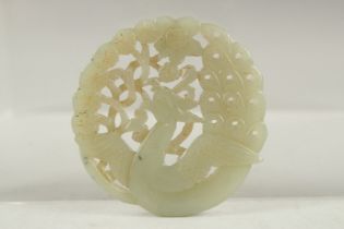 A FINE 19TH-EARLY 20TH CENTURY CHINESE CARVED JADE ROUNDEL, 5.5cm wide.