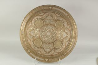 AN ISLAMIC CAIROWARE SILVER AND COPPER INLAID BRASS TRAY, 52cm diameter.