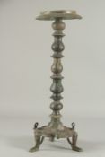 A 13TH CENTURY PERSIAN SELJUK PROBABLY KHURASAN BRONZE OIL LAMP STAND, with engraved decoration, the