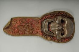 A TIBETAN RITUALISTIC METAL SKULL MASK.