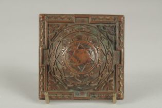 A VERY FINE 17TH -18TH CENTURY SOUTH INDIAN OR NEPALESE COPPER YANTRA, 7cm square.