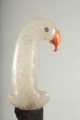 A CARVED ROCK CRYSTAL HILTED DAGGER, the handle formed as a bird head with wavey engraved blade,