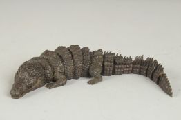 A JAPANESE BRONZE RETICULATED OKIMONO OF A CROCODILE, with mark to underside of head, 21cm long.