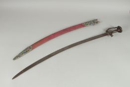 A 19TH CENTURY INDIAN TULWAR SWORD AND SCABBARD, the associated scabbard with silver chape and