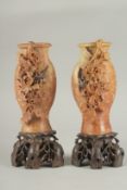 A PAIR OF 19TH CENTURY CHINESE FINELY CARVED SOAPSTONE VASES, 21cm high.