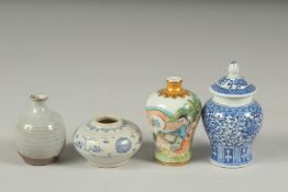 FOUR CHINESE MINIATURE POTTERY PIECES, including a small Hoi An Hoard shipwreck cargo pot, a famille