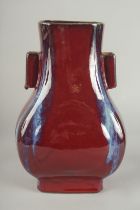 A CHINESE FLAMBE GLAZE PORCELAIN TWIN HANDLE VASE, 28cm high.