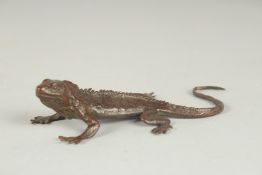 A JAPANESE BRONZE OKIMONO OF A LIZARD, with mark to underside, 15cm long.