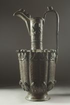 A 12TH CENTURY SELJUK SILVER INLAID BRONZE EWER, made of hammered bronze with relief beasts to the