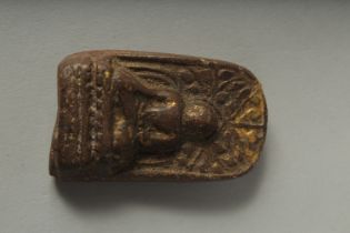 A SMALL 19TH CENTURY TIBETAN BUDDHISTIC AMULET, 6cm x 3.5cm.