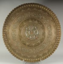 A VERY LARGE AND FINE ISLAMIC SILVER AND COPPER INLAID BRASS TRAY, with engraved and chased