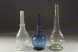 A COLLECTION OF THREE 18TH CENTURY MUGHAL INDIAN GLASS ROSEWATER SPRINKLERS, tallest 22cm high (3).