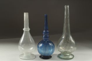 A COLLECTION OF THREE 18TH CENTURY MUGHAL INDIAN GLASS ROSEWATER SPRINKLERS, tallest 22cm high (3).