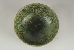 A VERY FINE 12TH - 13TH CENTURY PERSIAN GARUS WARE GLAZED POTTERY BOWL, depicting a mythological