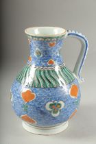 AN OTTOMAN TURKISH GLAZED POTTERY WATER JUG, 20.5cm high.