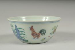 A CHINESE DOUCAI PORCELAIN CHICKEN CUP, 8.5cm diameter.
