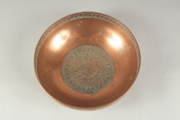 A FINE 18TH -19TH CENTURY INDO PERSIAN POSSIBLY SAFAVID ENGRAVED COPPER BOWL, 19.5cm diameter.