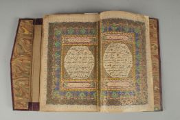 AN 18TH CENTURY OTTOMAN LEATHER BOUND ILLUMINATED QURAN, the manuscript written in naskh in black