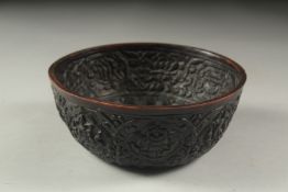 AN INDIAN CARVED COCONUT STYLE BOWL, 14.5cm diameter.