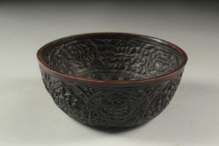 AN INDIAN CARVED COCONUT STYLE BOWL, 14.5cm diameter.