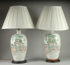 A PAIR OF CHINESE FAMILLE VERTE PORCELAIN VASE LAMPS, painted with female figures beside a tree,