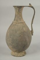 A RARE 8TH - 9TH CENTURY UMAYYAD BRONZE JUG, 31cm high.