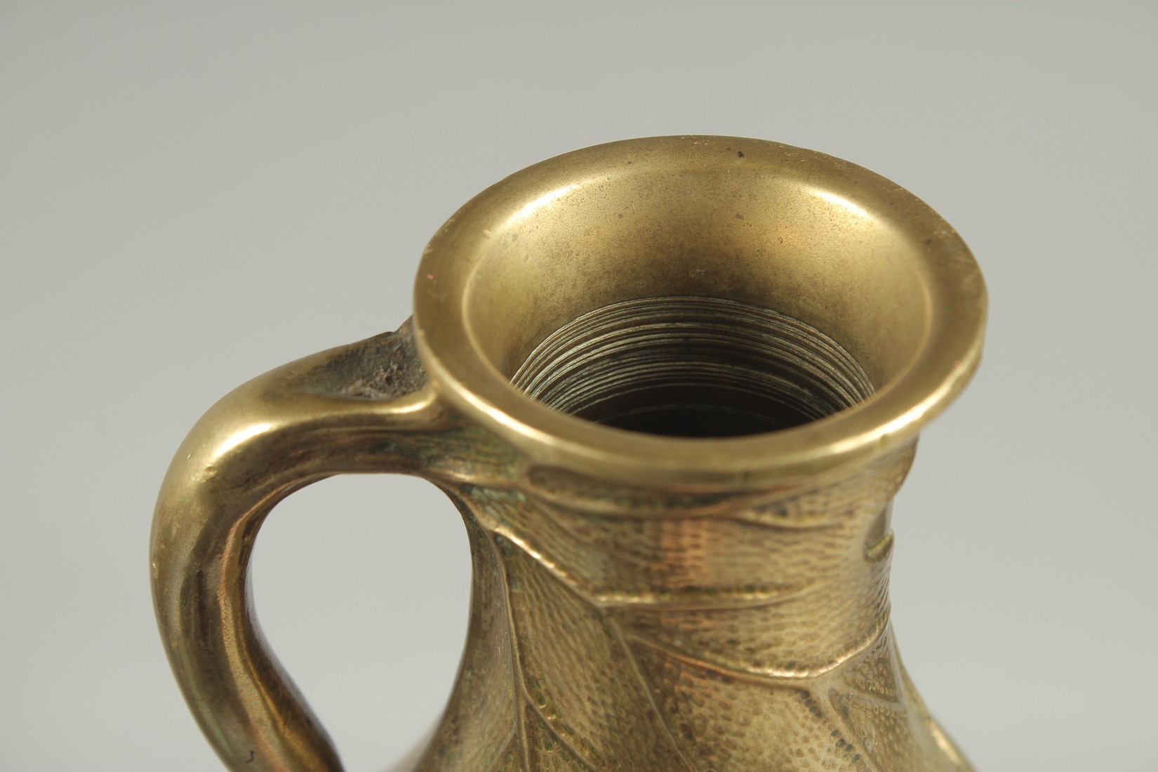 A JAPANESE BRASS JUG, with relief foliate decoration, 23cm high. - Image 5 of 6