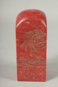 A LARGE CHINESE CARVED RED HARDSTONE SEAL, 15cm high.