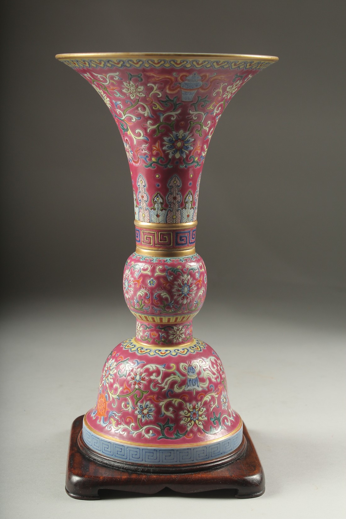 A CHINESE PINK GROUND FAMILLE ROSE PORCELAIN SECTIONAL GU VASE, and fitted hardwood stand, bearing - Image 6 of 10