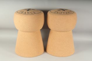 A PAIR OF CORK CHAMPAGNE STOOLS. 18ins high.