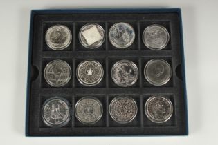A SET OF TWELVE VARIOUS SILVER CROWNS including Edward VII and 11 Elizabeth II. Boxed.
