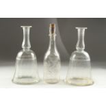 A PAIR OF GEORGIAN BELL SHAPE DECANTERS (no stoppers) and an engraved decanter (3).