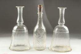 A PAIR OF GEORGIAN BELL SHAPE DECANTERS (no stoppers) and an engraved decanter (3).