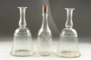 A PAIR OF GEORGIAN BELL SHAPE DECANTERS (no stoppers) and an engraved decanter (3).