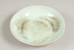 A CHINESE SANG DE BOEUF CIRCULAR DISH, six character mark. 6ins high.