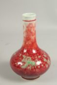 A CHINESE SPLASH RED BOTTLE VASE, six character mark. 7ins high.