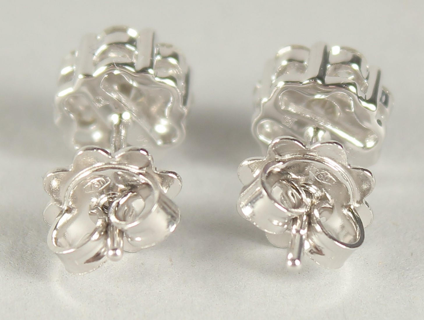 A PAIR OF 18CT WHITE GOLD DIAMOND CLUSTER EAR STUDS, approx. 1ct, in a box. - Image 2 of 2