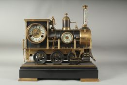 A VERY GOOD LOCOMOTIVE CLOCK a train with three dials,six wheels on a marble base.