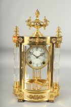 A GOOD LOUIS XVIthSTYLE GILT METAL SERPENTINE SHAPED FOUR GLASS CLOCK with cut glass columns and urn
