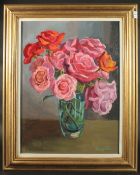 Muggleton (20th Century), A still life of pink and orange roses in a blue glass vase, oil on