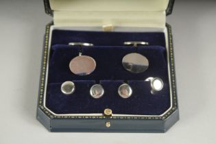 A STERLING SILVER CUFF LINKS AND STUDS in a box.