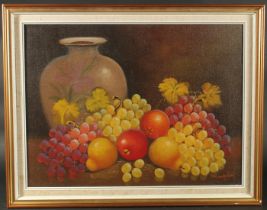 20th Century, A still life of mixed fruit with an urn, oil on canvas, indistinctly. Signed, 18" x